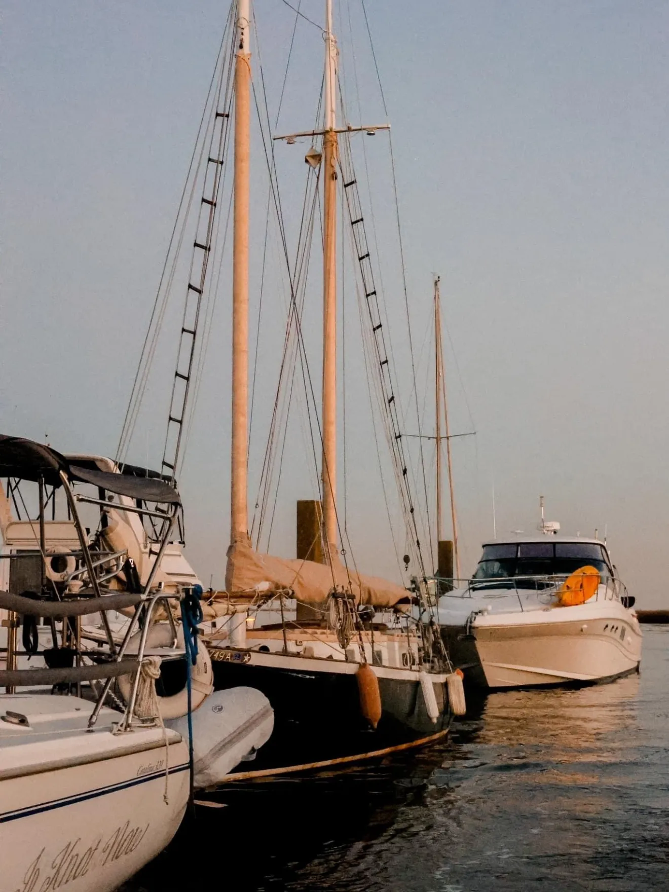 a boat is docked next to a body of water