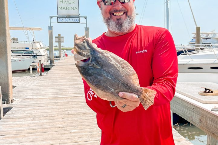 a man holding a fish