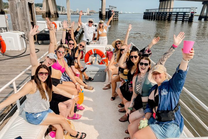 a group of people sitting at a beach