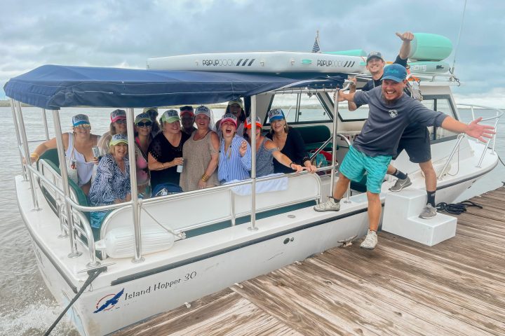 a group of people standing around a plane