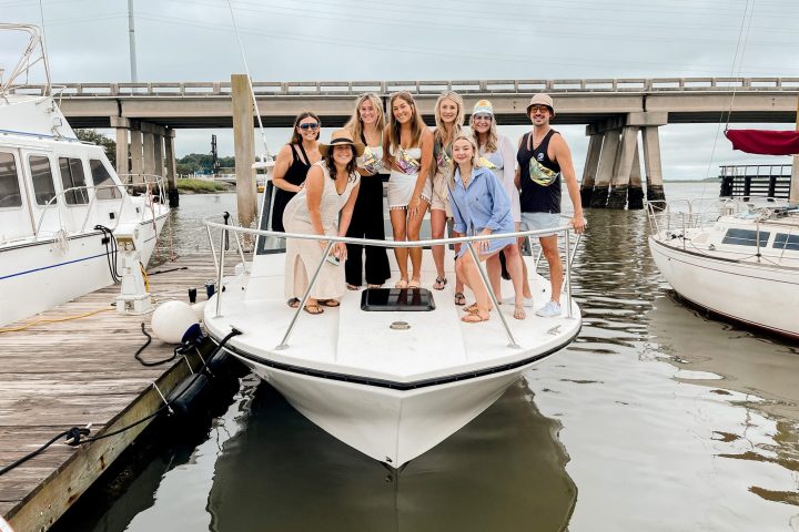 a group of people on a boat in the water
