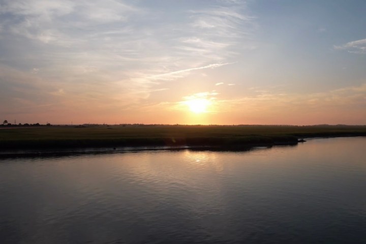 a sunset over a body of water